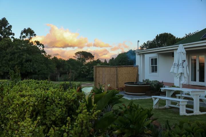 The cottage and garden in the sunset light