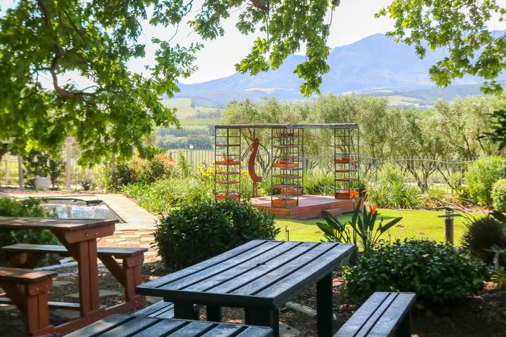 Garden seating with a pergola and mountain views