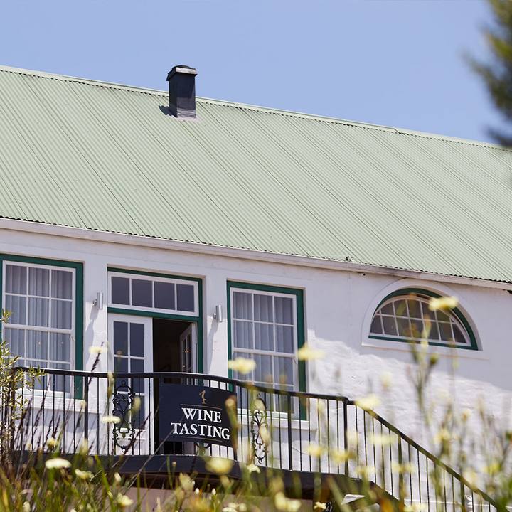 The tasting room entrance on the whitewashed building