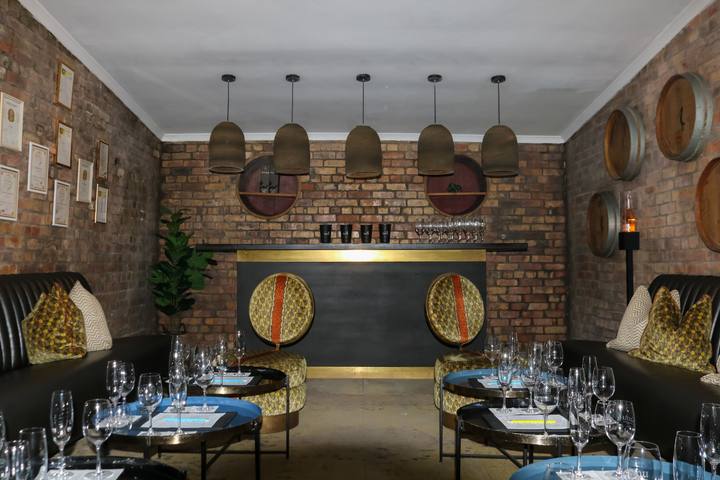Tasting room with pendant lights and brick walls