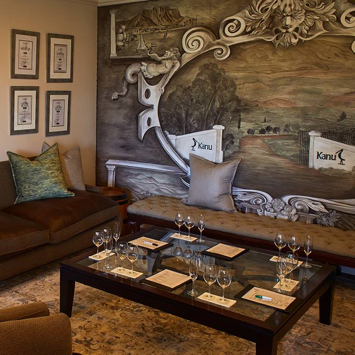 Carved-wall tasting lounge with a low table